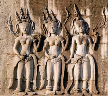 Three dancing apsara on the wall in Angkor Wat clipart