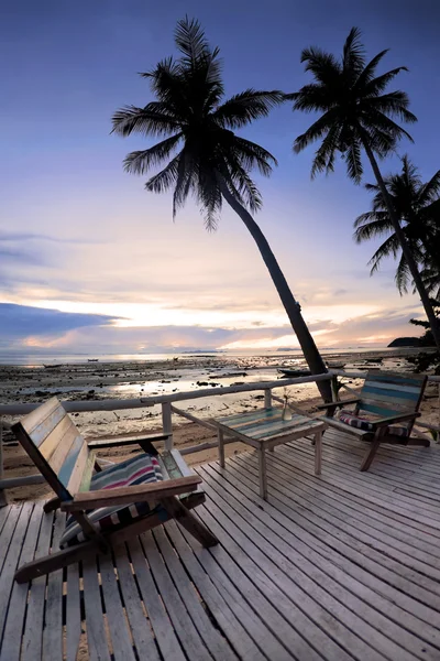 Café outdoor with terrace on sunset beach — Stockfoto