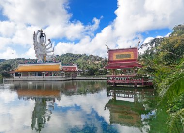 Statue of Chenrezig in Wat Plai Laem temple clipart