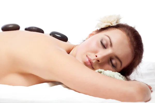 Woman getting massage with hot stone. — Stock Photo, Image