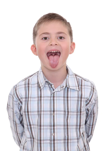 Niño con la lengua fuera de la boca — Foto de Stock