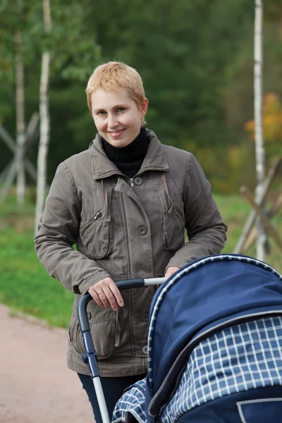 Stock image Young mummy with a baby