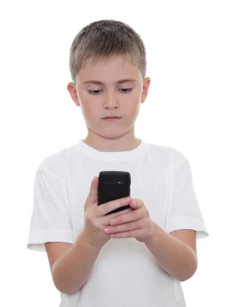 Un chico con un teléfono móvil — Foto de Stock