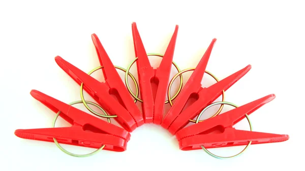 Five red pegs situated around — Stock Photo, Image