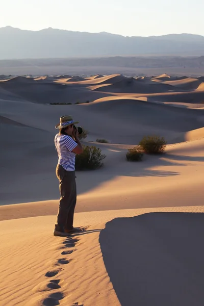 stock image Woman photographer in a T-short