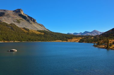 The mountains and azure lake Tioga clipart