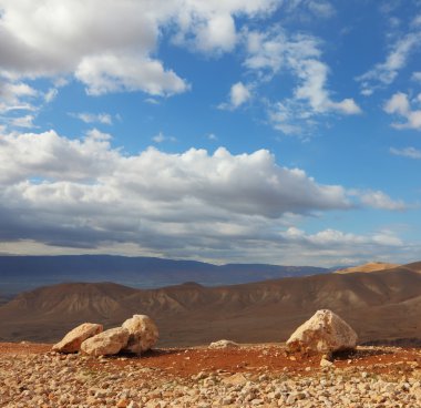 Huge boulders along highway, an unflawed sky clipart