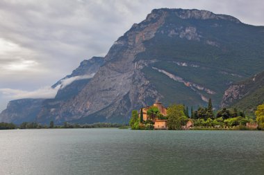 Toblino lake a medieval castle clipart