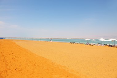 Middle-aged woman on the beach luxury hotel