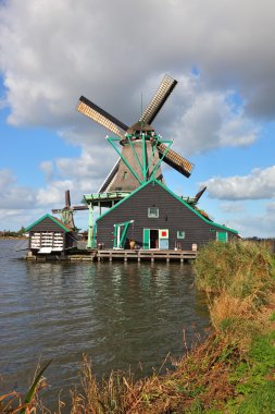 A old windmill in the Dutch village clipart