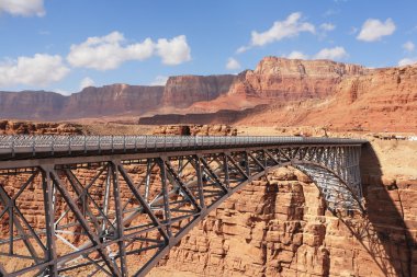 The metal bridge in abrupt coast of desert clipart