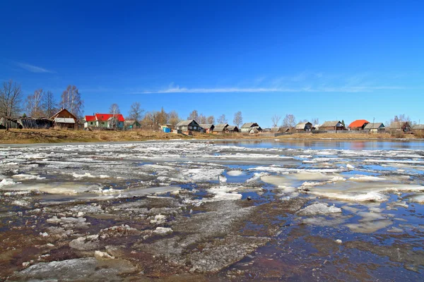 Driving of ice on river near villages — Stock Photo, Image