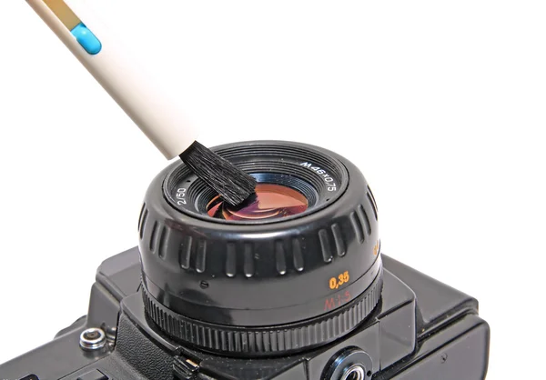 Cleaning the lens on white background — Stock Photo, Image