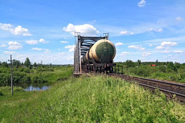 Freight train near railway bridge — Stock Photo, Image