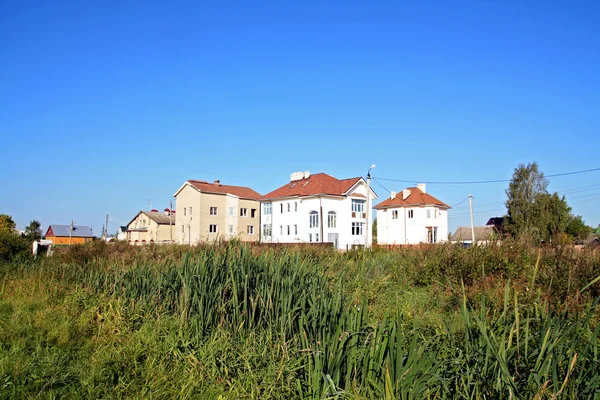 stock image New cottages near green marsh