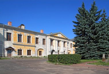 Town park near old-time building clipart