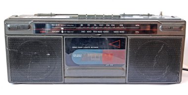 Old cassette tape-recorder on white background clipart