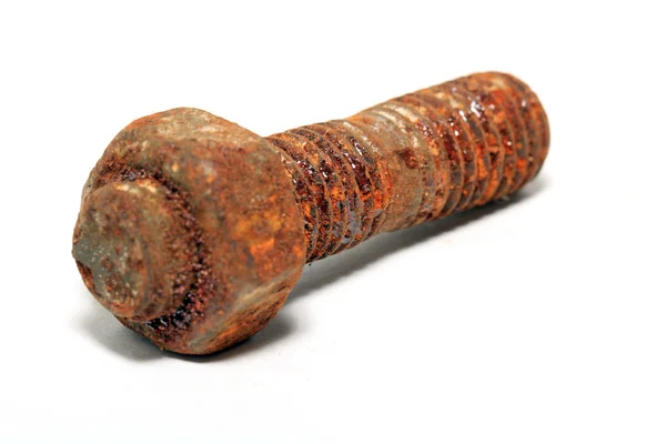 Aging rusty nut on white background — Stok fotoğraf
