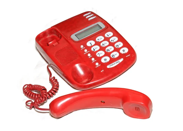 Altes rotes Telefon auf weißem Hintergrund — Stockfoto