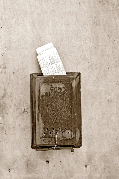 stock image Old mailbox on wooden door, sepia