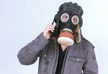 Businessman dress a gas mask clipart
