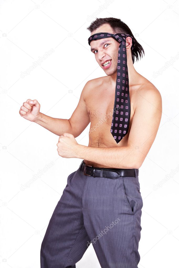 Businessman with necktie in karate pose