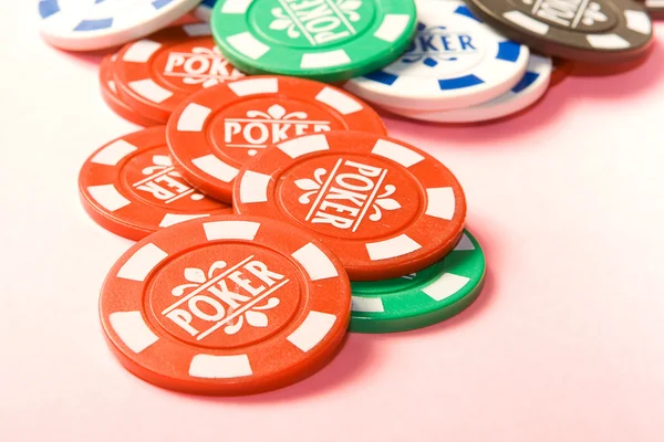 Gambling chips on a bright pink background — Stock Photo, Image