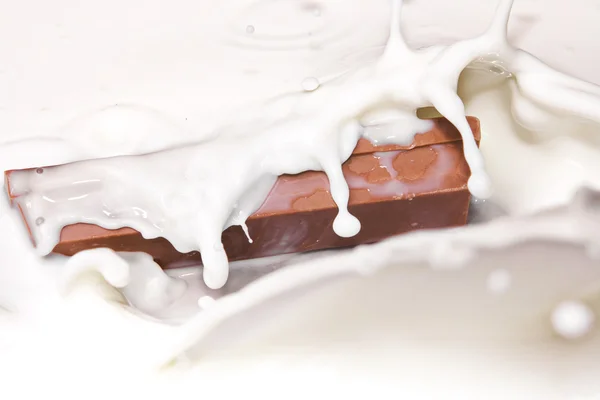 stock image Splash of chocolate falling in cream