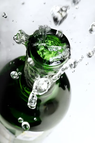Splash over bottle — Stock Photo, Image