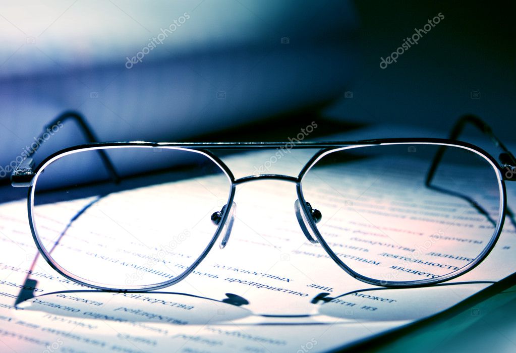 Eyeglasses on the book