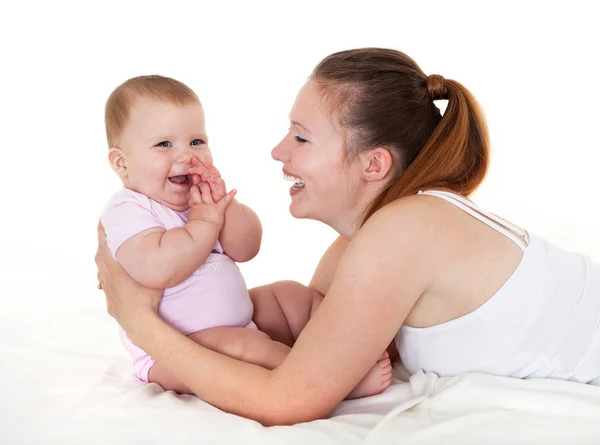 Happy mum plays with the small daughter. — Stock Photo, Image