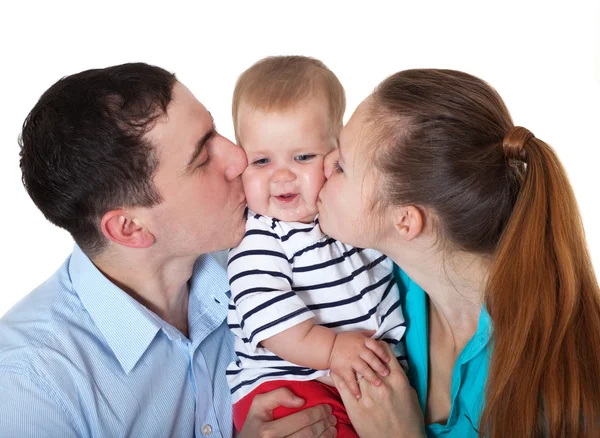 Šťastní rodiče kiss babe. — Stock fotografie