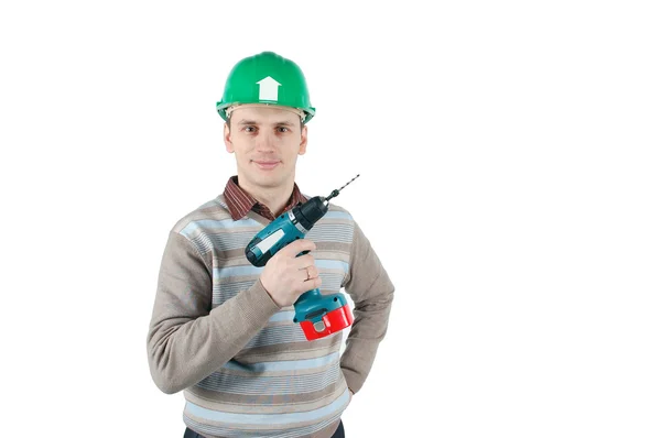Young married man holds an electric drill in his hand — Stock Photo, Image