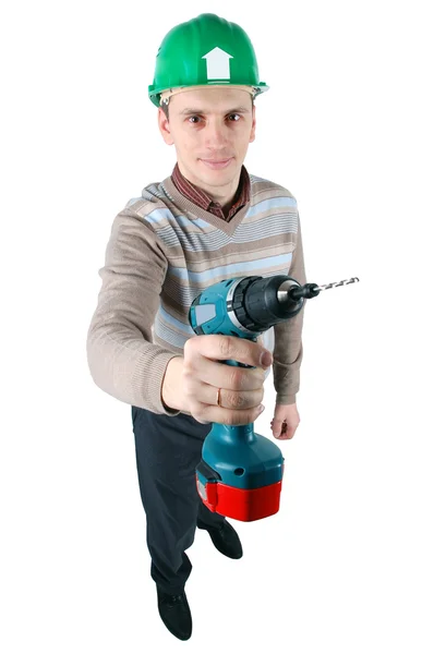 stock image Young worker holds a drill in his hand