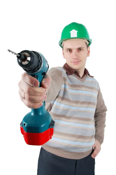 Young worker holds a drill in his hand — Stock Photo, Image