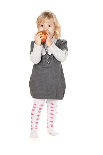 Baby flicka äta äpple — Stockfoto
