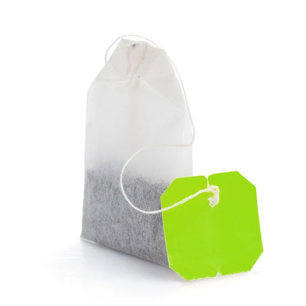 Чайная сумка с зеленой этикеткой — стоковое фото