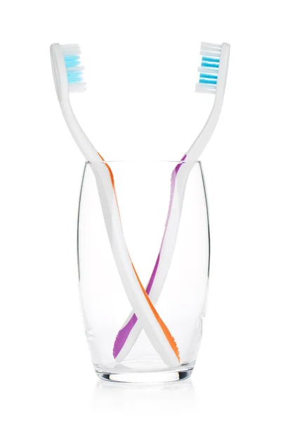 Two toothbrushes in a glass — Stock Photo, Image