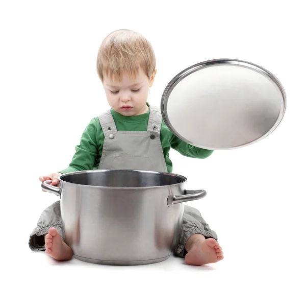 Baby looking inside saucepan — Stock Photo, Image