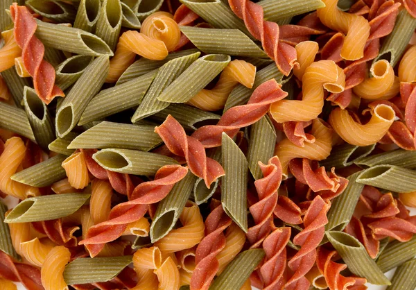 Barevné těstoviny potravin pozadí — Stock fotografie
