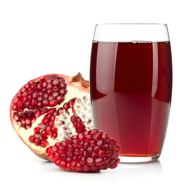 Pomegranate juice in a glass and ripe pomegranate — Stock Photo, Image