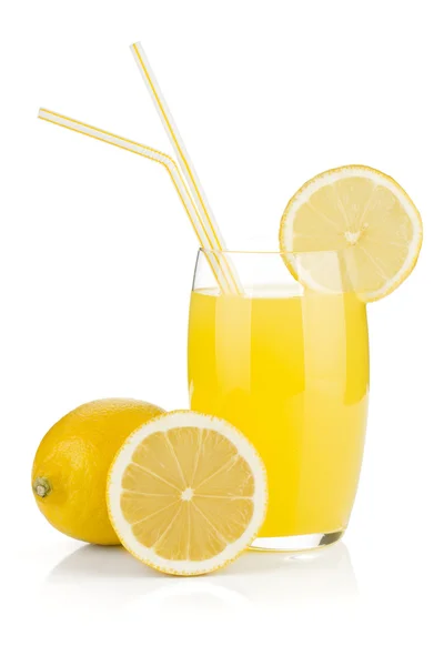 Lemon juice glass and fresh lemons — Stock Photo, Image