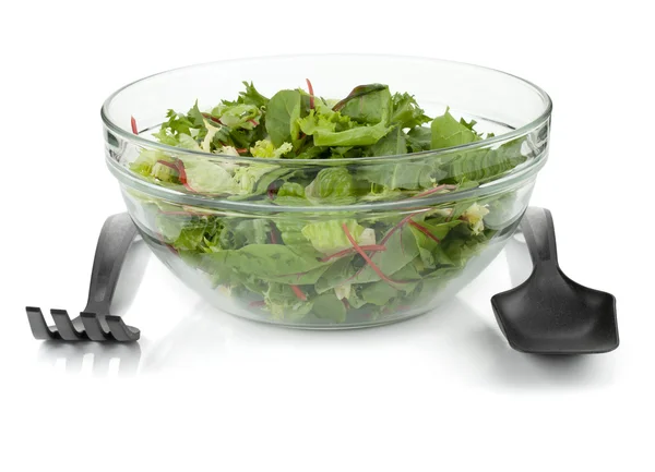 Healthy green salad with plastic utensils — Stock Photo, Image