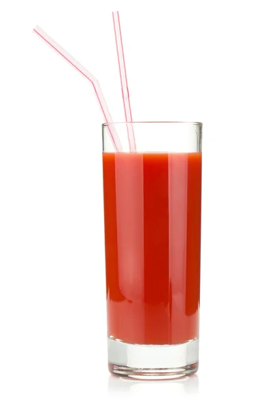 Томатный сок в стакане с двумя соломинками — стоковое фото