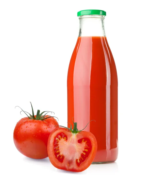 Garrafa de suco de tomate e tomates maduros — Fotografia de Stock