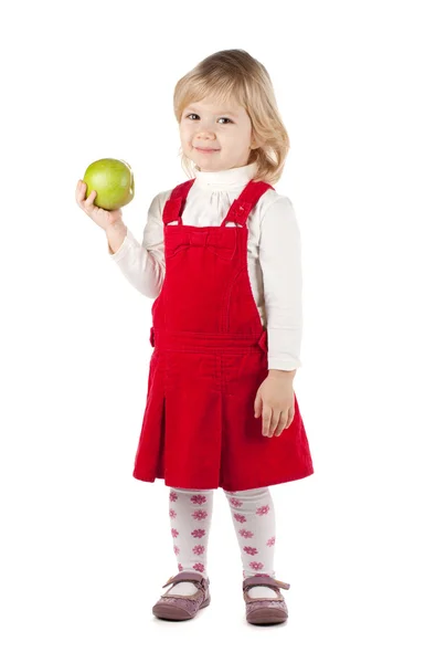 Улыбающаяся малышка с зеленым яблоком — стоковое фото