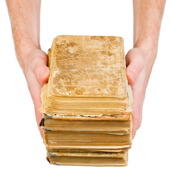 Hands holding old books isolated on white — Stock Photo, Image