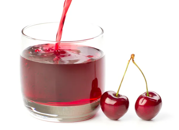 stock image Cherries and a glass of cherry juice isolated on white