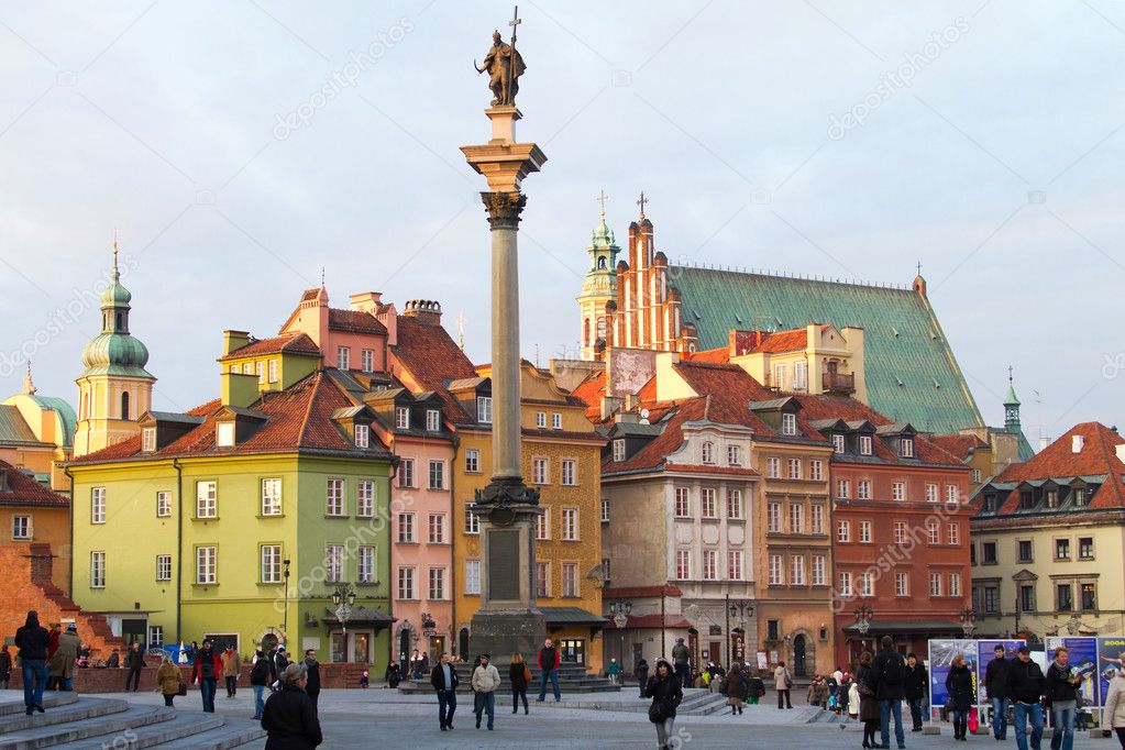 WARSAW - NOVEMBER 27: Tourists walk around the Castle Square in