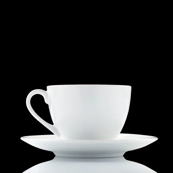 stock image White coffee cup over black background